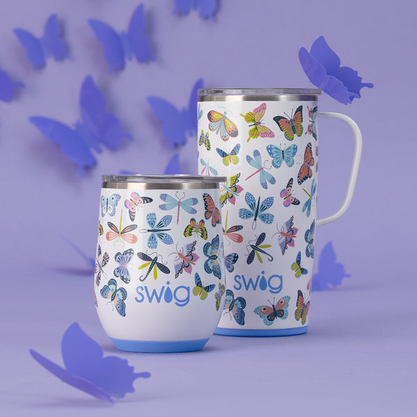 Swig Life Insulated Butterfly Bliss 22oz Travel Mug and 12oz Stemless Wine Cup on a purple background