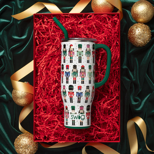 Swig Life 30oz Classic Nutcracker Insulated Mega Mug gift wrapped surrounded by gold holiday ornaments