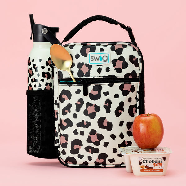 Swig Life Luxy Leopard Boxxi Lunch Bag with a Flip + Sip Water Bottle and snacks on a pink background