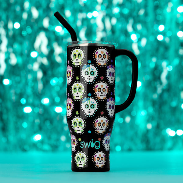 Swig Life Sugar Skulls Insulated 30oz Mega Mug on a blue sparkling background