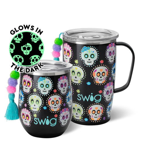 Swig Life Sugar Skulls AM+PM Set including a 22oz Travel Mug and a 32oz Tumbler in front of a red paper fan